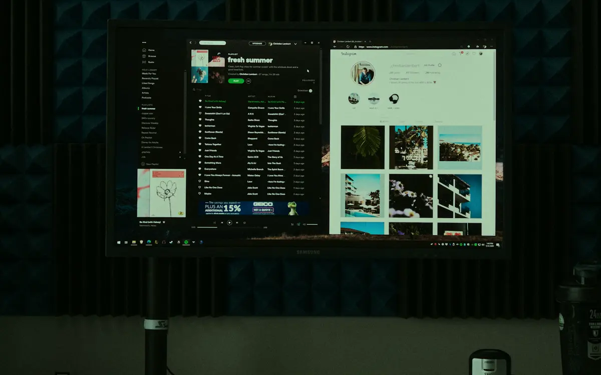 Monitor on a desk showing a web app and a website side by side